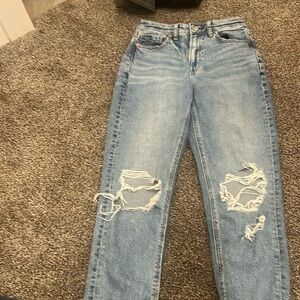 Blue ripped straight legged jeans